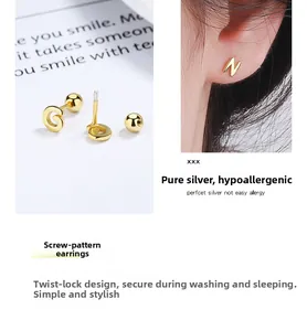 Detail of 925 sterling silver golden letter studs with secure screw back closure