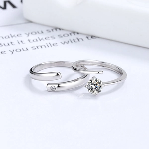 Adjustable sterling silver couple rings set with cubic zirconia in a minimalist design