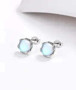 Close-up of S925 sterling silver mermaid tear earrings with iridescent moonstone