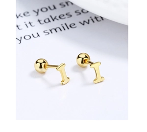 Macro shot of 925 silver golden letter I stud earrings with secure screw back closure