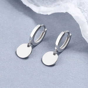 Minimalist 925 sterling silver geometric round disk hoop earrings on a grey surface