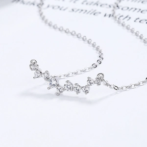 925 silver wave necklace with 7 round zircon stones in 45-degree close-up view