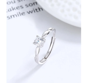 Macro shot of S925 sterling silver Mobius ring with a brilliant round zircon stone