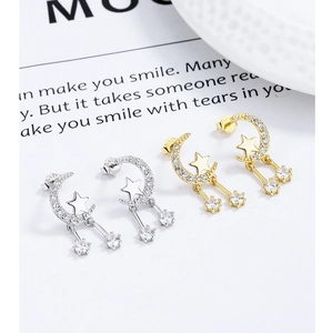 Detail of star and moon tassel earrings with sparkling zircons and S925 silver studs