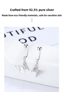 Macro shot of 925 sterling silver hollow butterfly earring with polished finish