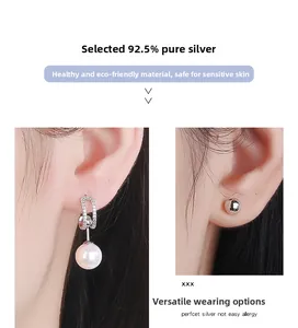 Détail de boucles d'oreilles en argent 925 et perles montrant le design amovible polyvalent