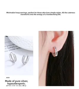 Detail of 925 sterling silver double-layer hoop earrings with micro-inlaid zircon