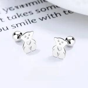 Detailed macro view of S925 sterling silver bear stud earrings with screw ball backs