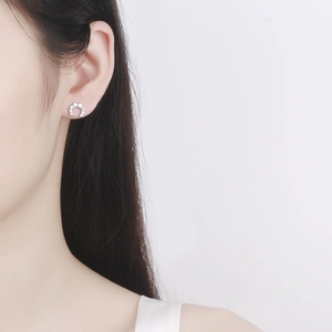 925 Sterling silver horseshoe stud earrings with zircon stones on a female model