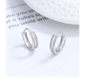 Macro view of S925 sterling silver hoop earrings with double-row zircon micro-pave setting