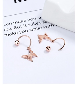 Detail of rose gold bow earrings with screw back closure and 925 sterling silver finish