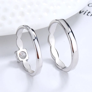 S925 silver Mobius couple rings with sparkling zircon inlay and textured wave band