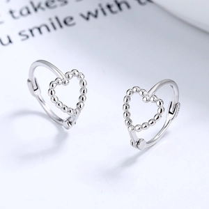 925 Sterling Silver hollow heart hoop earrings featuring a beaded texture design