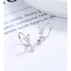 Close-up of S925 sterling silver bow earrings with marquise zircon and drop pendant