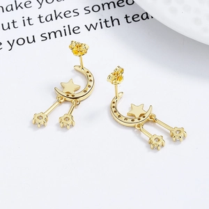 Elegant gold star and moon tassel earrings with sparkling crystals for a luxury look