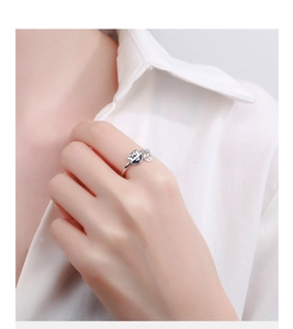 Detailed view of S925 sterling silver lucky cat open ring with a small coin pendant charm
