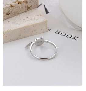 Detail view of the S925 sterling silver hallmark on the adjustable cat ring band