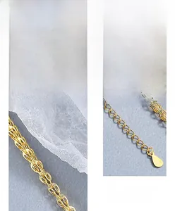 Detailed macro view of S925 sterling silver phoenix necklace with gold-plated texture