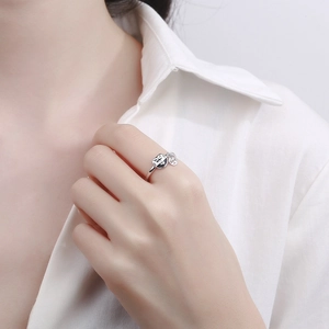 925 Sterling silver cat ring with lucky coin charm on hand against white background