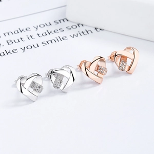 Boucles d'oreilles cœur en argent 925 avec zircons en finitions argent et or rose