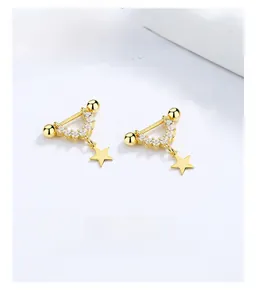Macro shot of 18K gold plated star earrings with pavé zircons and ball screw back closure