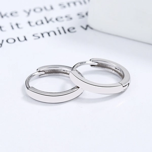 Minimalist 925 sterling silver hoop earrings with a high-polished finish on white card