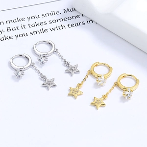 Star tassel drop earrings in silver and gold with shimmering pavé crystal settings
