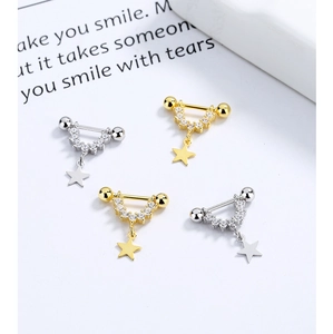 Macro detail of 925 sterling silver star U-shaped ear cuffs with cubic zirconia inlay