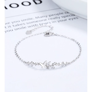 Detail of 925 sterling silver butterfly bracelet with sparkling zircon stones and lobster clasp