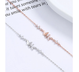 Detailed view of 925 silver butterfly bracelets with rose gold finish and zircon stones