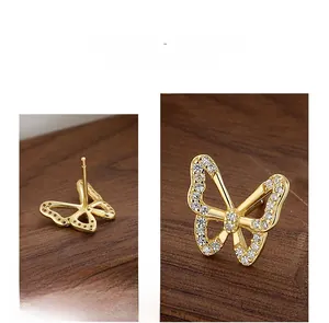 Detailed view of sterling silver butterfly stud earrings with sparkling cubic zirconia