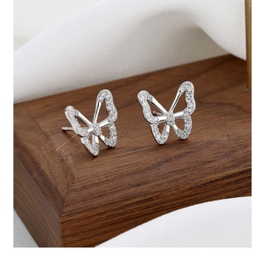 Macro shot of butterfly stud earrings with sparkling pavé cubic zirconia inlay