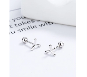 Detailed macro view of S925 sterling silver geometric screw back studs with ball backing