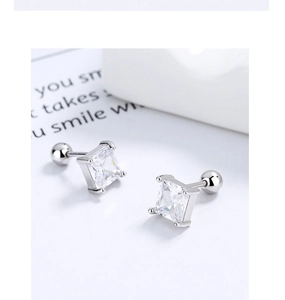 Macro detail of square zircon stud earrings with 925 silver screw back closure