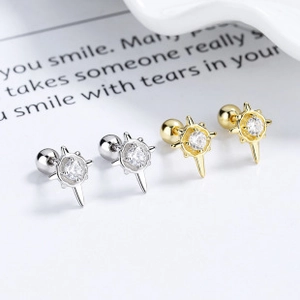 Detail of S925 sterling silver star stud earrings with cubic zirconia and screw backs