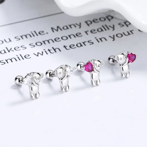 Close-up of S925 silver teddy bear stud earrings with pink and clear cubic zirconia