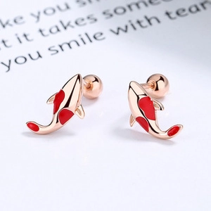 Detailed macro view of S925 silver koi earrings with red enamel and screw-back closure