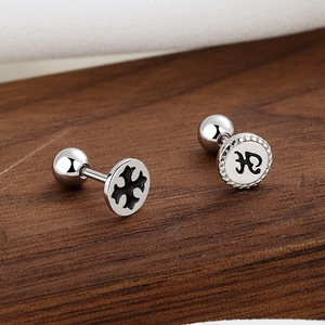 Gothic 925 sterling silver cross screw back studs with black enamel on wood surface