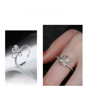 Detail of adjustable bow ring in 925 silver with cubic zirconia inlays for women