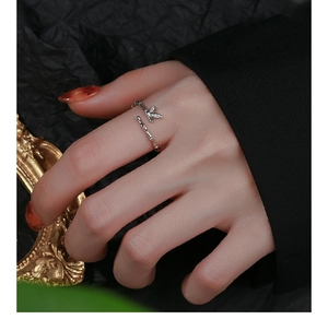 Detail of 925 sterling silver bamboo joint open ring on finger with leaf accents