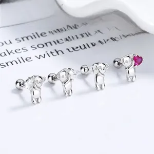 Macro detail of 925 silver koala stud earrings with pink heart stones and screw backs