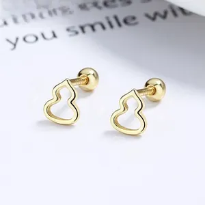 Macro shot of 925 silver gourd earrings with screw-back design and polished gold finish