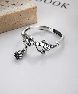Detailed view of S925 silver koi fish ring with lotus pendant in vintage style