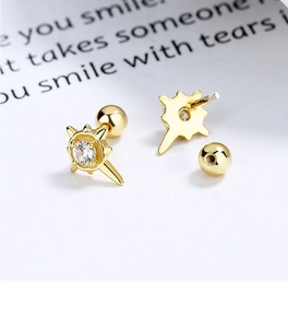 Détail macro du clou d'oreille étoile doré avec zircone et fermoir à vis sécurisé