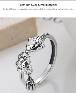Macro detail of 925 sterling silver lotus koi ring with vintage oxidized finish and charm