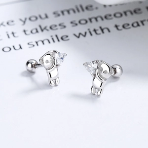 Cute S925 sterling silver koala stud earrings holding a heart-shaped cubic zirconia stone