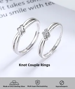 Close-up of S925 sterling silver knot rings with polished finish and pave-set zircons