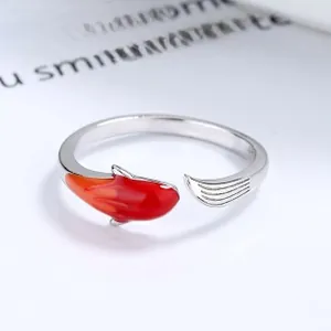 Macro view of 925 silver koi carp ring with red enamel finish and engraved 925 hallmark