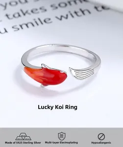 Macro shot of 925 sterling silver koi fish ring with red and orange enamel detailing