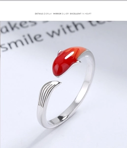 Macro detail of 925 silver koi fish ring featuring orange gradient enamel finish